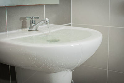 Close-up of faucet in bathroom