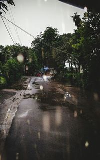 Wet street in city during rainy season