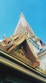 Low angle view of statue against blue sky