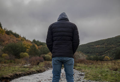 Portrait of adult man walking along river in autumn, in tejera negra, cantalojas, guadalajara, spain