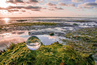 Scenic view of sea against sky during sunset