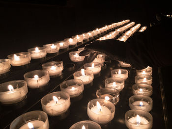 Illuminated candles in temple