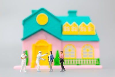 Full frame shot of toys against colored background