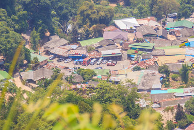 High angle view of houses and trees in town