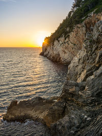 Scenic view of sea against sky during sunset