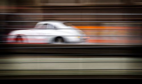 Blurred motion of train at railroad station