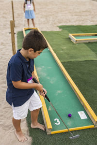 Children playing mini golf