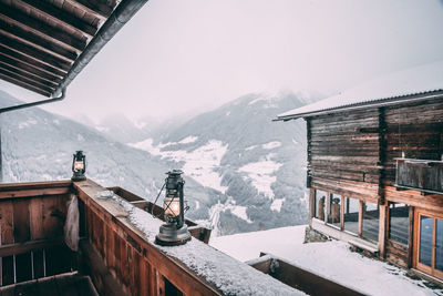 Built structure on snowcapped mountain against sky