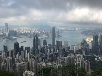 Aerial view of city and buildings against sky