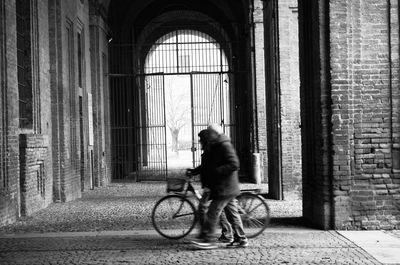 Side view of a man riding bicycle