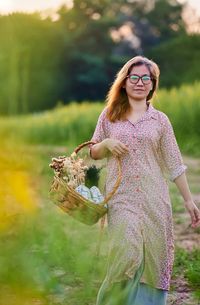 Portrait of woman walking in the rural field