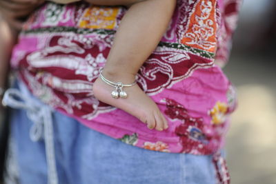 Midsection of woman with pink hair