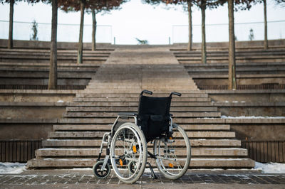 Rear view of man walking on staircase