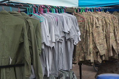 Close-up of clothes hanging in store for sale