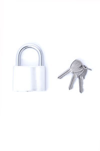 Close-up of padlock on white background