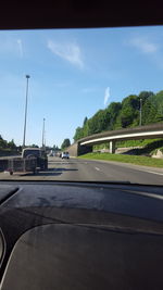 Road seen through car windshield