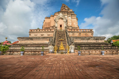 View of temple building against cloudy sky