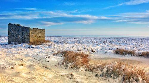 Scenic view of sea against sky during winter