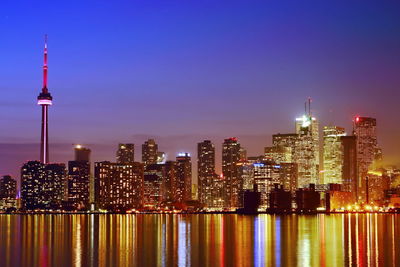 Illuminated buildings in city at night