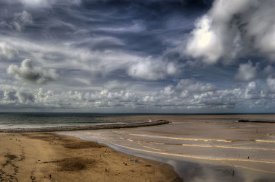 Scenic view of beach against sky