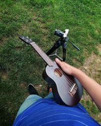 Low section of person standing on field