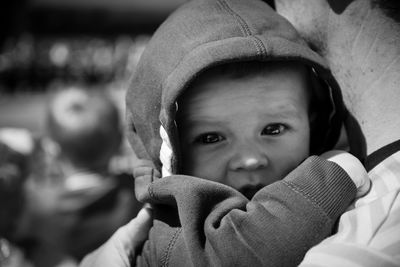 Cropped father holding cute baby boy