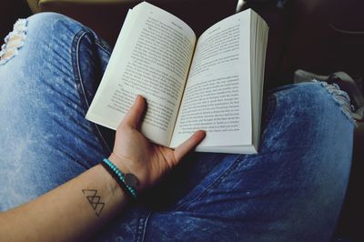 Full length of two people reading book