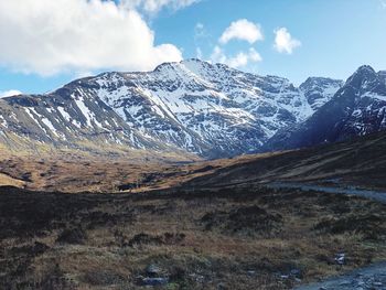 Scenic view of snowcapped mountains against sky