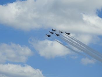 Low angle view of airplane flying in sky