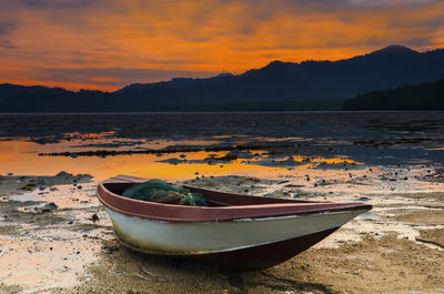 Scenic view of beach against sky during sunset