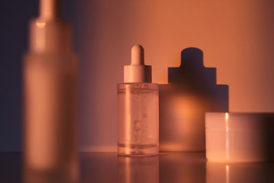 Close-up of bottles against black background