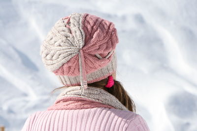Rear view of woman wearing knit hat during winter