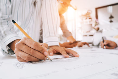 Close-up of man working on table