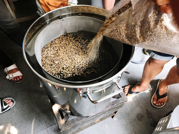 High angle view of man preparing beer