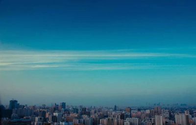 Cityscape against blue sky