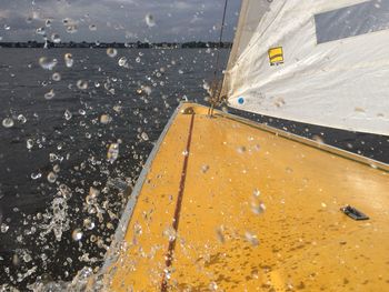 High angle view of wet road by sea