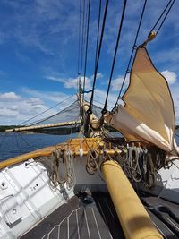 Sailboat sailing in sea against sky