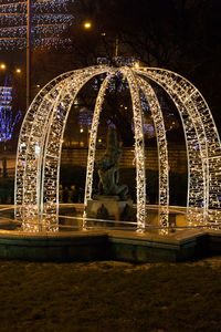 Illuminated carousel at night