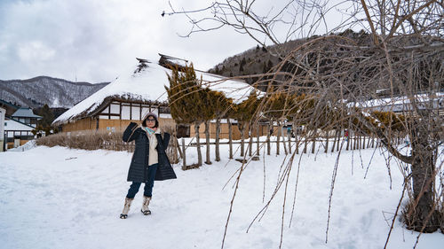 People walking on snow covered field