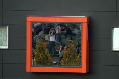 Reflection of people on glass window