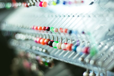 Close-up of earrings for sale at market stall