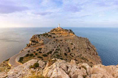 Scenic view of sea and rocks against sky