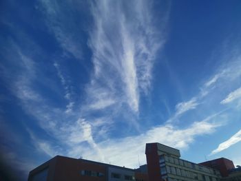 Low angle view of buildings against blue sky