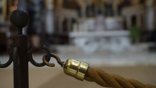 Close-up of person holding chain