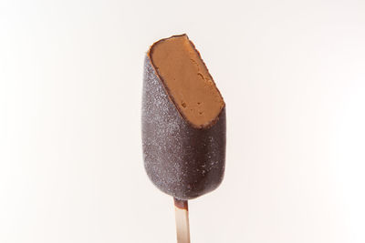 Close-up of chocolate cake against white background