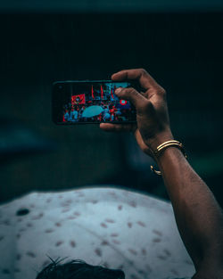 Close-up of hand holding smart phone