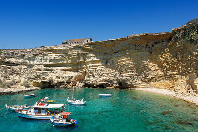 Scenic view of sea against clear blue sky