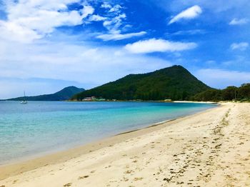 Scenic view of shoal bay against sky