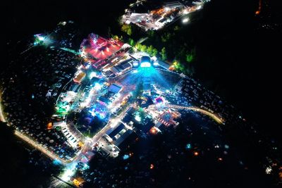 High angle view of illuminated buildings in city at night