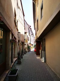 Narrow alley amidst buildings in city